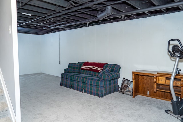 basement featuring light colored carpet