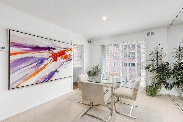 dining area featuring light colored carpet, visible vents, baseboards, and recessed lighting