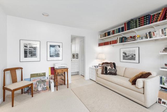 sitting room featuring carpet flooring