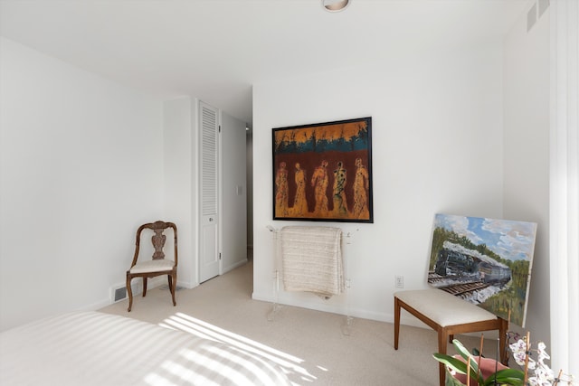 bedroom with visible vents, baseboards, and light colored carpet