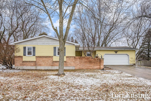 single story home with a garage