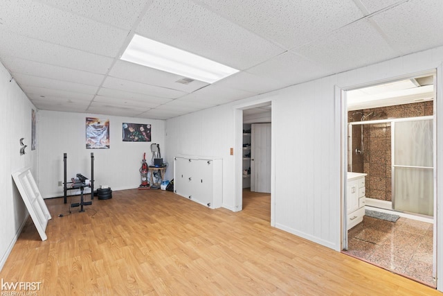 interior space with light hardwood / wood-style flooring and a paneled ceiling