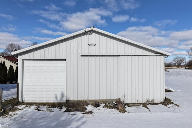 view of snow covered garage