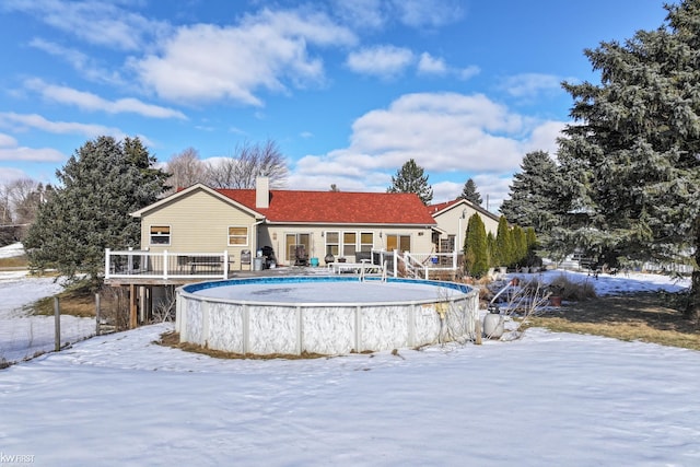 view of snow covered house