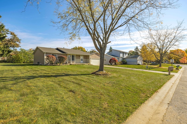 view of front of home with a garage and a front yard