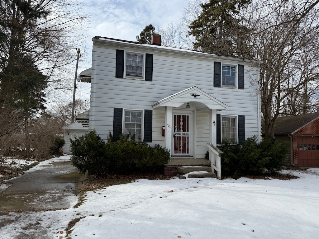 colonial home with a garage