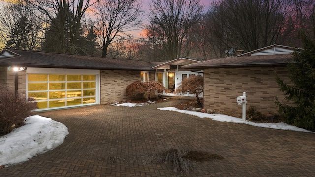 ranch-style home with a garage