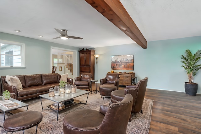 living room featuring beamed ceiling, ceiling fan, and wood-type flooring