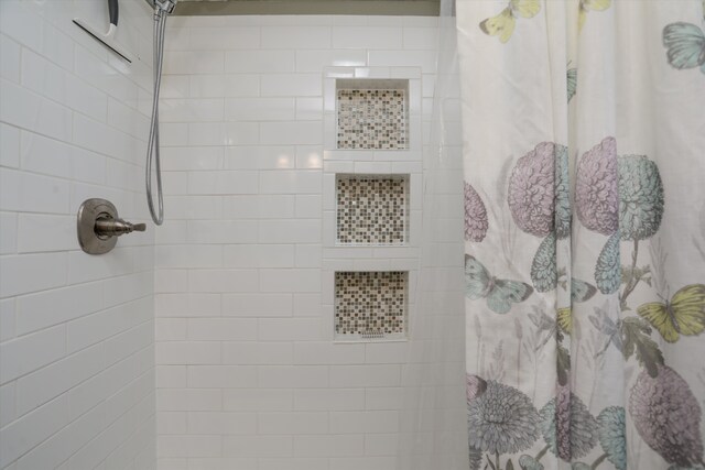 bathroom featuring curtained shower