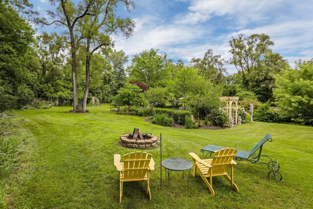 view of yard with a fire pit