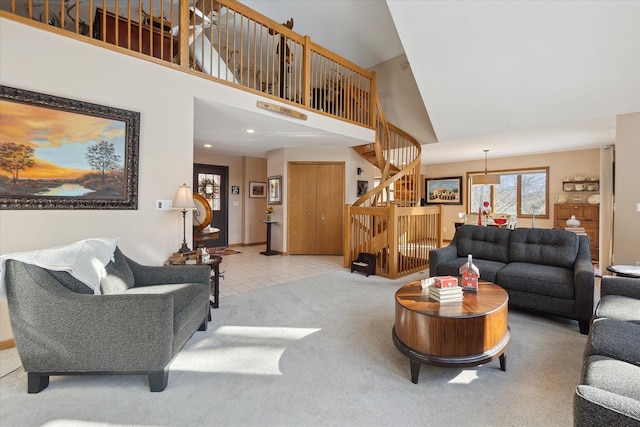 carpeted living room featuring a high ceiling