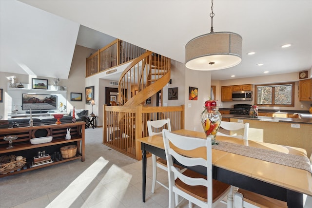 dining space featuring light colored carpet