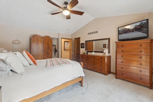 carpeted bedroom with ceiling fan and lofted ceiling