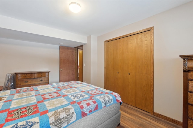 bedroom with a closet and light wood-type flooring