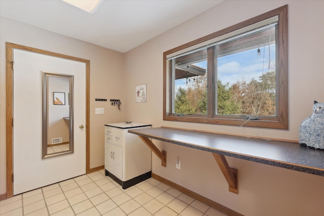 laundry room with light tile patterned flooring