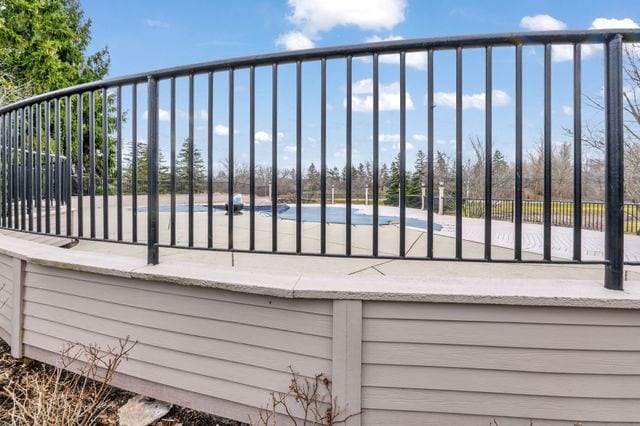 wooden deck featuring a covered pool