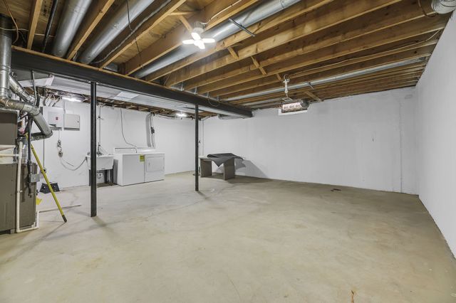 basement with washer and dryer and sink