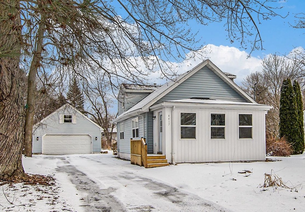 view of front of home with an outbuilding and a garage