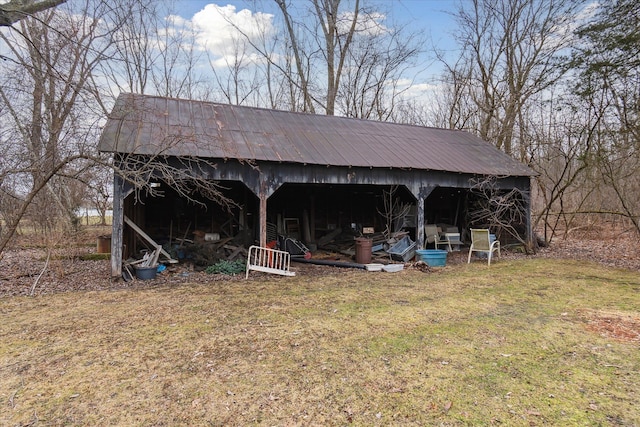 view of outbuilding featuring a lawn