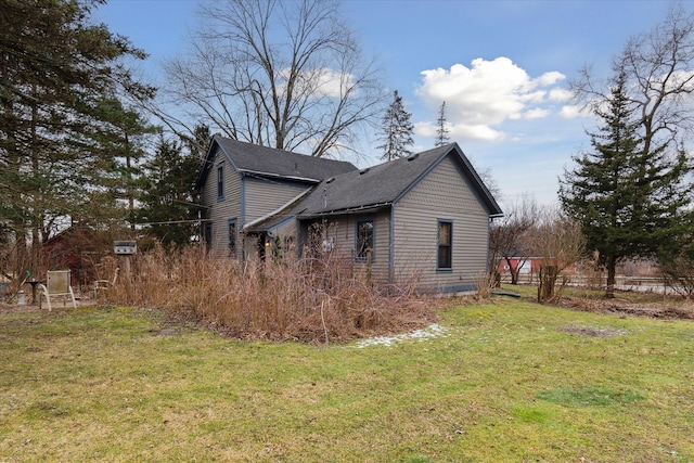 view of home's exterior featuring a yard