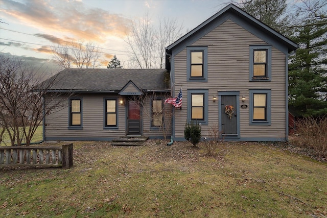 view of front of home with a lawn