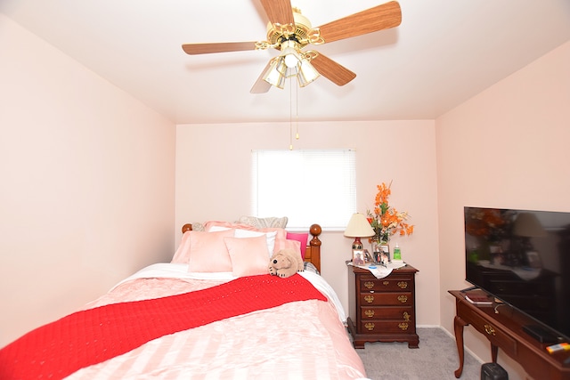 bedroom with ceiling fan and carpet flooring