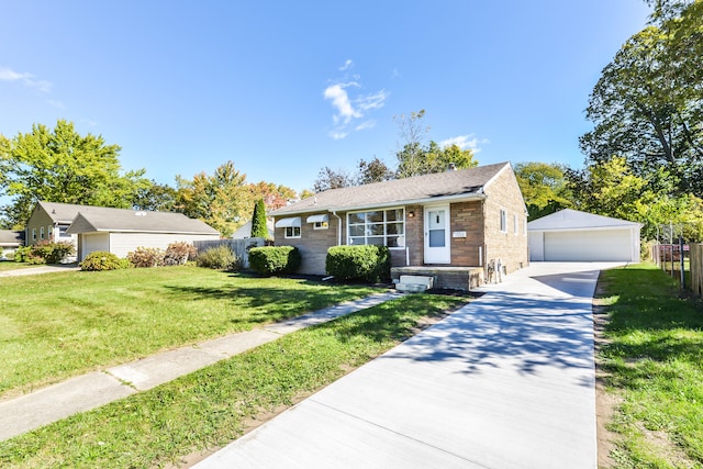 view of front of house featuring a garage, fence, a front lawn, and an outdoor structure