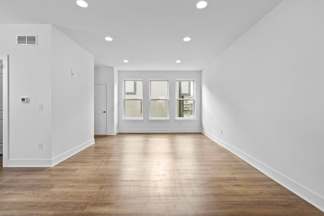 empty room with light hardwood / wood-style floors