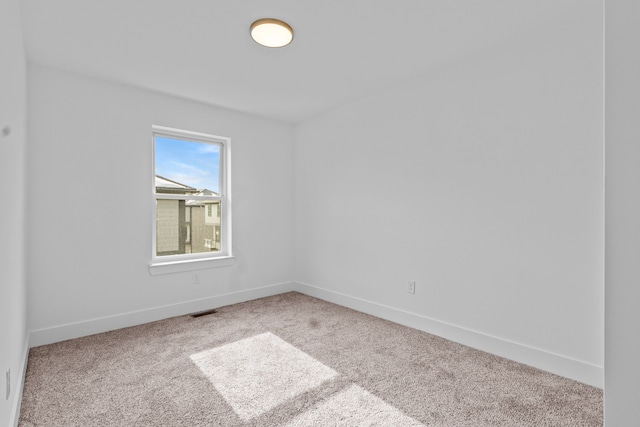 empty room featuring carpet flooring