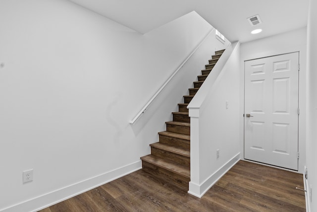 staircase featuring hardwood / wood-style floors