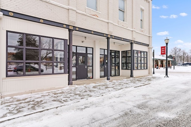 view of snow covered property entrance