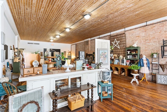 bar featuring brick wall, hardwood / wood-style floors, and wooden ceiling