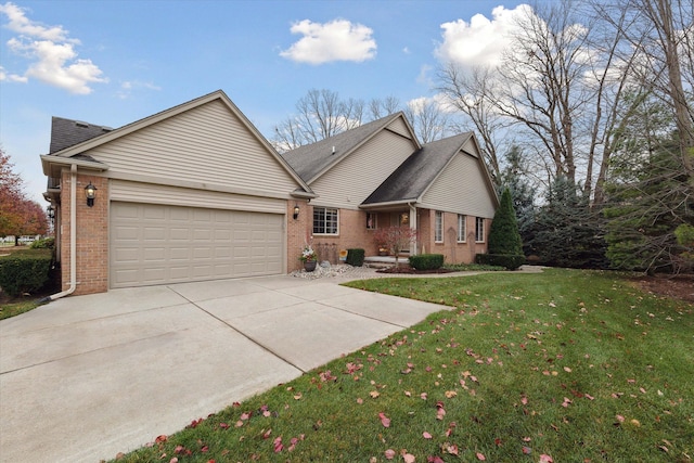 view of front of property with a front yard and a garage