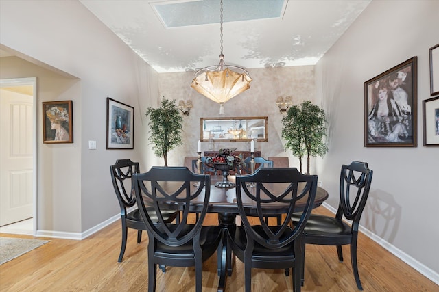 dining space with light wood-type flooring