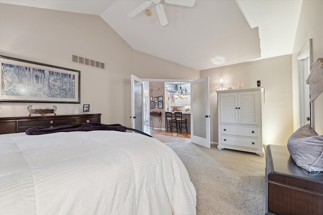 bedroom featuring light carpet, high vaulted ceiling, and ceiling fan