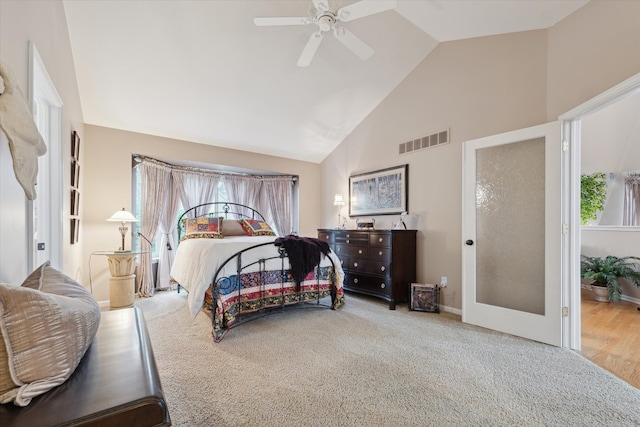 bedroom featuring high vaulted ceiling, ceiling fan, and light colored carpet