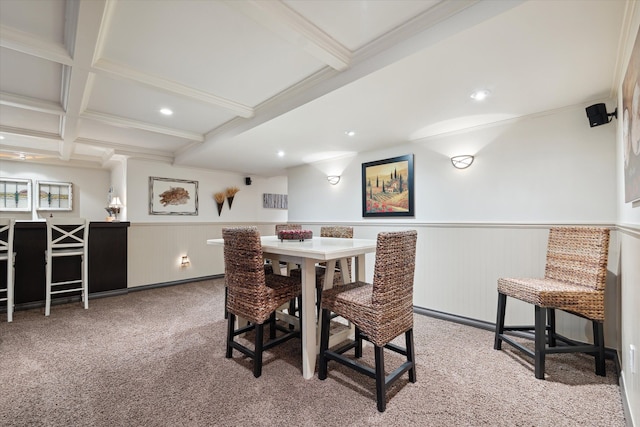 carpeted dining area featuring beam ceiling, ornamental molding, and coffered ceiling