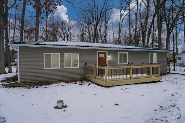 single story home featuring a deck