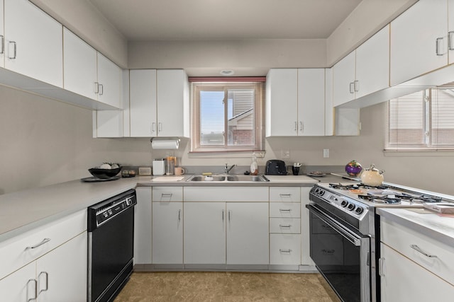 kitchen with stainless steel gas range oven, dishwasher, sink, and white cabinets