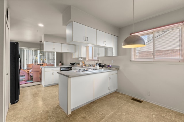 kitchen featuring black appliances, white cabinetry, decorative light fixtures, and kitchen peninsula