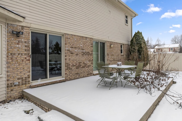 view of snow covered patio