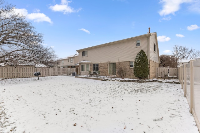 view of snow covered property