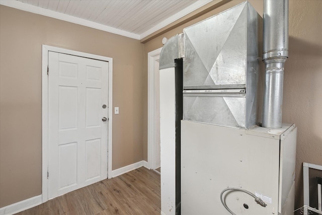 utility room featuring heating unit