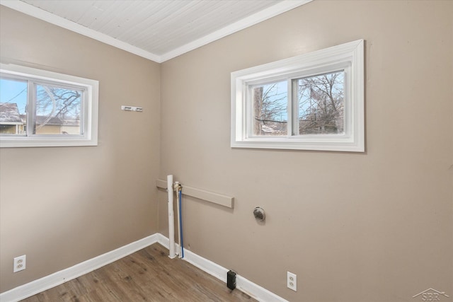 washroom with hardwood / wood-style floors and ornamental molding