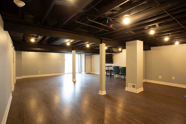 basement featuring dark hardwood / wood-style floors