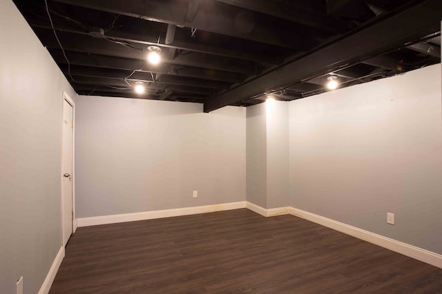 basement featuring dark hardwood / wood-style floors