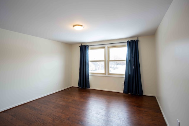 empty room featuring dark hardwood / wood-style floors