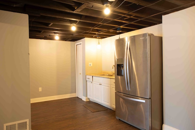 kitchen featuring white cabinetry, stainless steel fridge with ice dispenser, sink, and dark hardwood / wood-style floors