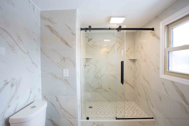 bathroom featuring toilet, an enclosed shower, and tile walls