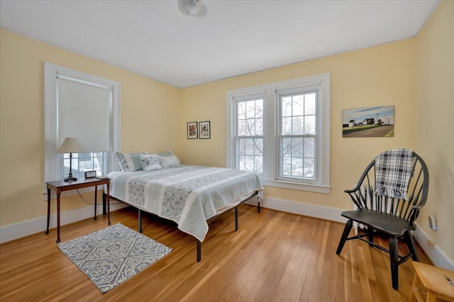 bedroom with light hardwood / wood-style flooring